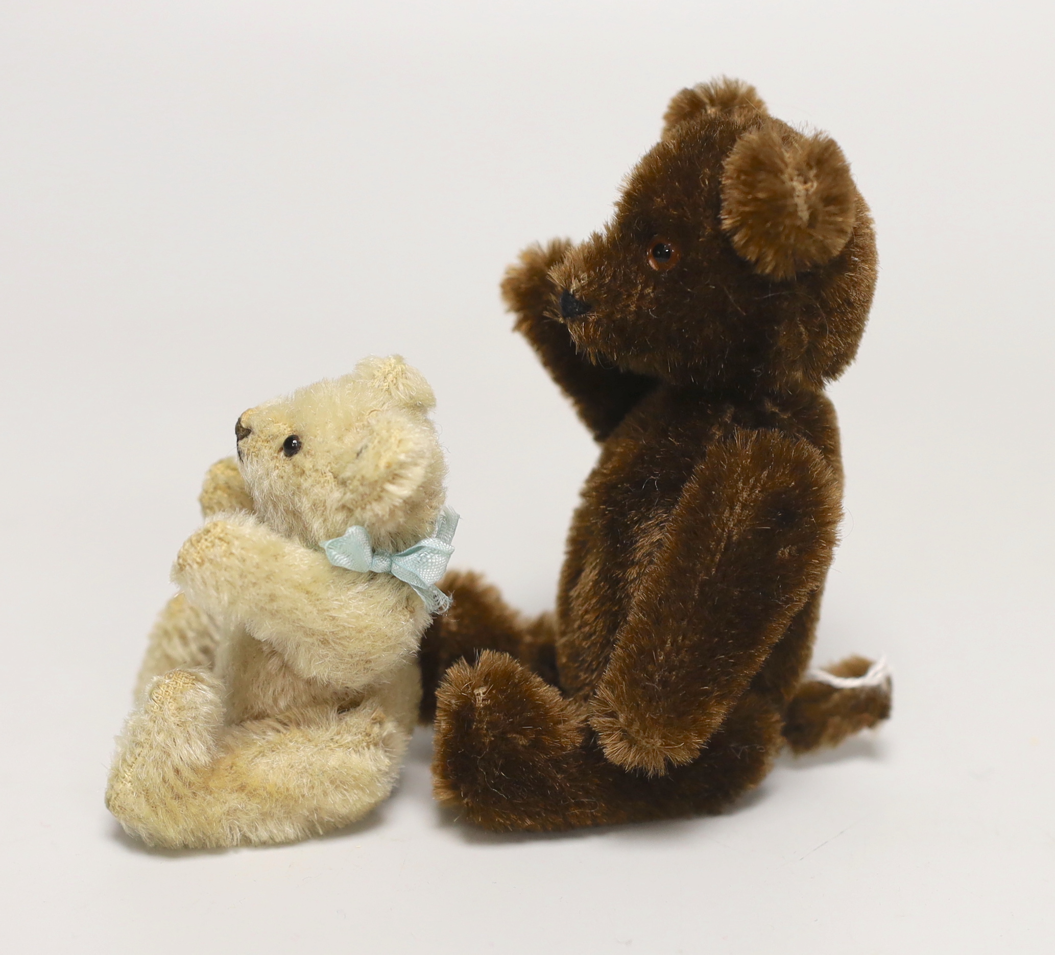 A Schuco Yes/No brown mohair, 1950's, 5in., excellent condition, and a 1950's Steiff bear with button, 3in., excellent condition